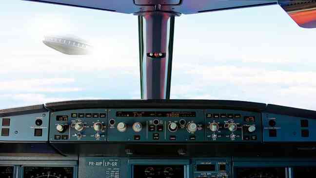 Pilot reports “flying saucer” passing feet from passenger jet during landing